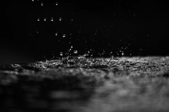 many drops of water close-up in free fall