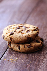 Chocolate cookies on wooden table. Chocolate chip cookies shot