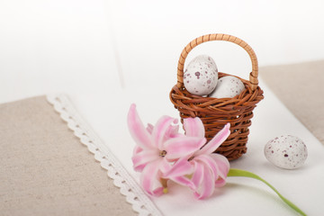 Little Braided Wooden Basket With Chocolate Eggs On Handmade Nat