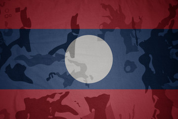 flag of laos on the khaki texture . military concept