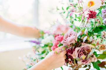 Florist making bouquet for wedding