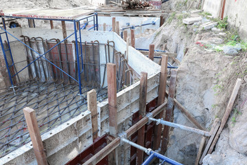 Fototapeta na wymiar Hole of foundation construction building site making reinforceme