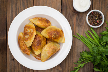 Fried dumplings. Wooden background. Top view