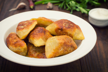 Fried dumplings. Wooden background. Top view