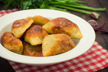 Fried dumplings. Wooden background. Top view