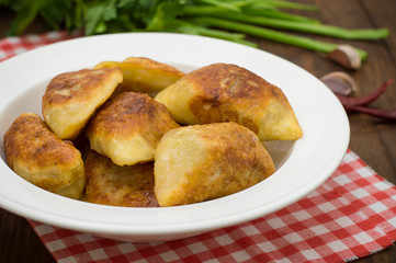 Fried dumplings. Wooden background. Top view