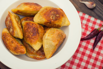 Fried dumplings. Wooden background. Top view