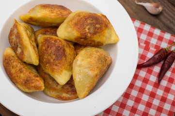 Fried dumplings. Wooden background. Top view