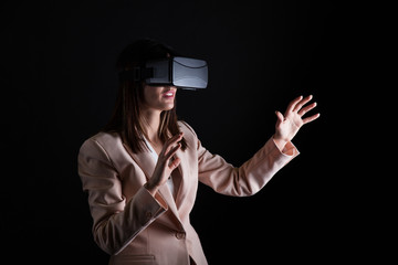 Fototapeta premium Businesswoman playing virtual reality simulation