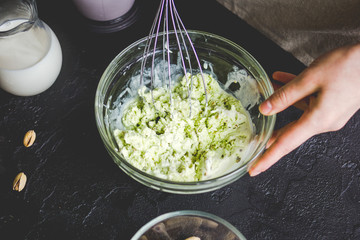 organic ice cream homemade process on dark background with hands