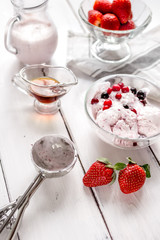 organic homemade ice cream in glass bowl on wooden background