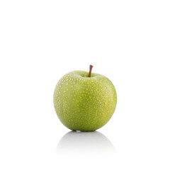 Green apple with water drop. Studio shot isolated on white