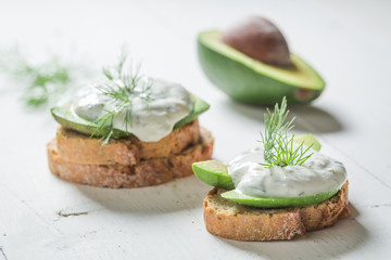 Healthy sandwich with tzatziki sauce and avocado
