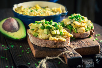 Homemade fried eggs with chive and avocado