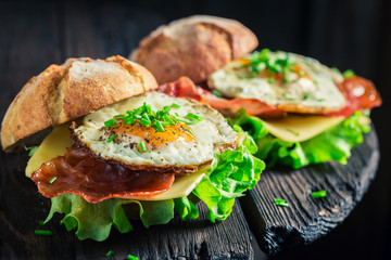 Fresh burger with eggs, cheese and bacon