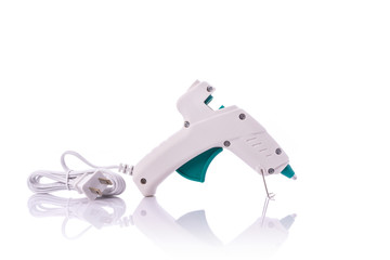 New white glue gun. Studio shot isolated on white