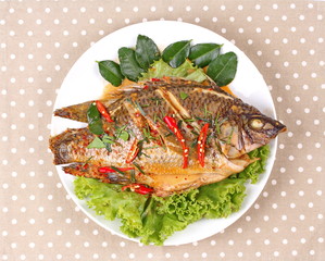 Curry-fried Tilapia fish with spicy topping.