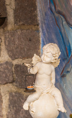 statue of angel holding a lantern