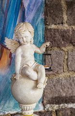 Fototapeta na wymiar statue of angel holding a lantern