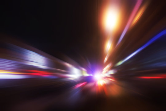 Traffic lights in motion blur at night.