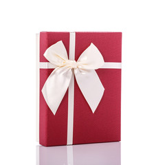 New color gift box with ribbon. Studio shot isolated on white