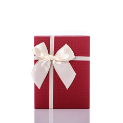 New color gift box with ribbon. Studio shot isolated on white