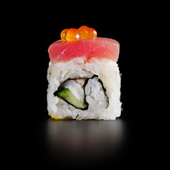 traditional fresh japanese sushi rolls on a black background