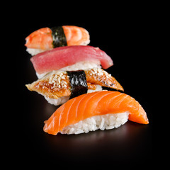 traditional fresh japanese sushi on a black background