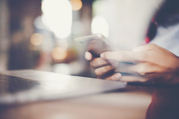 Close up of woman's hands holding smartphone. 