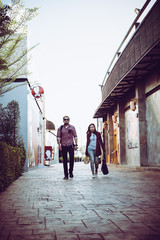 Fototapeta na wymiar Portrait of hipster couple walking in the street urban. 
