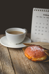 Relax time with Hot Coffee and Donut on wood Background used for