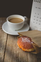 Relax time with Hot Coffee and Donut on wood Background used for