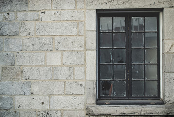 Fototapeta na wymiar winter season brick wall texture background with glass window fo