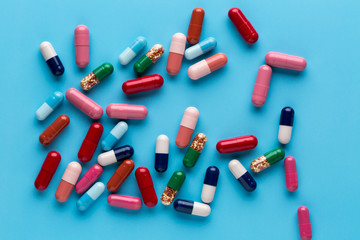Different multicolored pills and medicine capsules