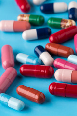 Different multicolored pills and medicine capsules