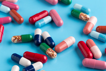 Different multicolored pills and medicine capsules