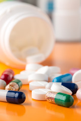 Different multicolored pills and medicine capsules