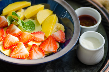 Clay bowl with fruit oatmeal