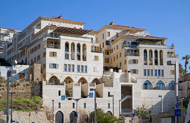Fototapeta na wymiar Modern apartment buildings in old port of Jaffa, emulating old middle eastern architecture