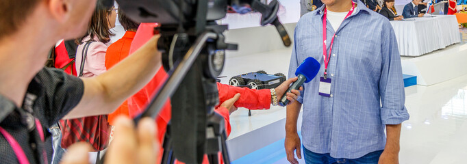 Interviewing businessman on press on business meeting