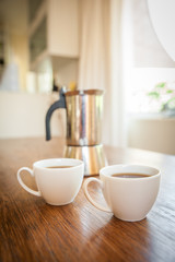 Fototapeta na wymiar white cups and coffee plunger