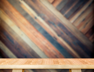 modern wooden table top at blurred diagonal wood plank wall,Temp