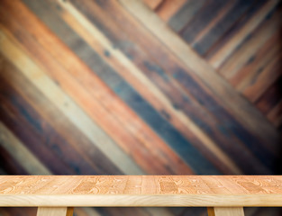 modern wooden table top at blurred diagonal wood plank wall,Temp