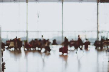 Obraz premium Blurred background,Traveler with baggage at Terminal Departure C