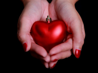 Woman hands with red heart . Space for text. Concept Valentines Day art design.