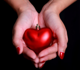 Woman hands with red heart . Space for text. Concept Valentines Day art design.