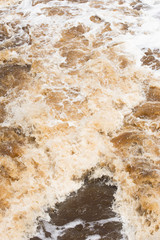 Close up Wild swirling river  running rough