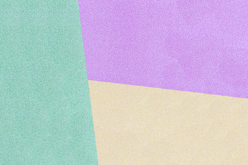 green, yellow and purple pastel background. Top view.