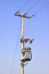 electric poles under the blue sky background