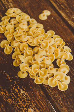 Italian pasta food, in a wood table on background